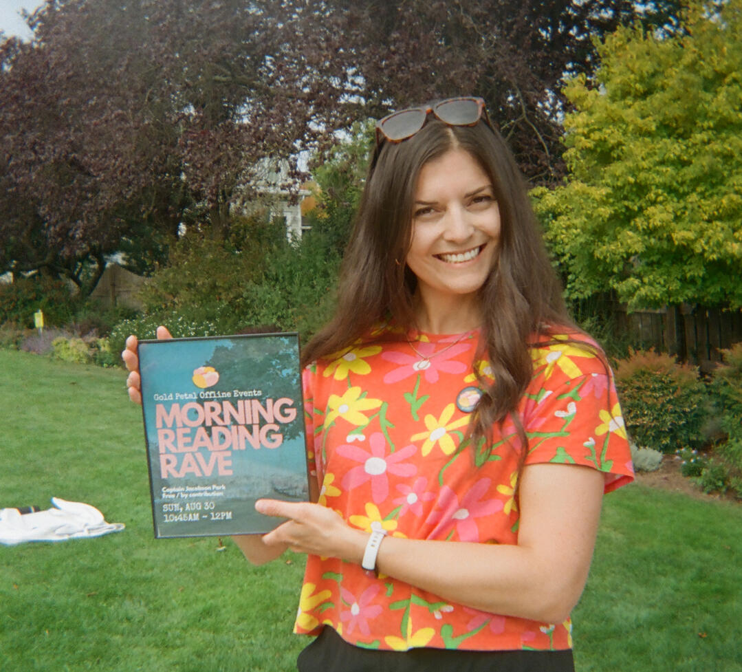 A photo of Diana holding a poster.